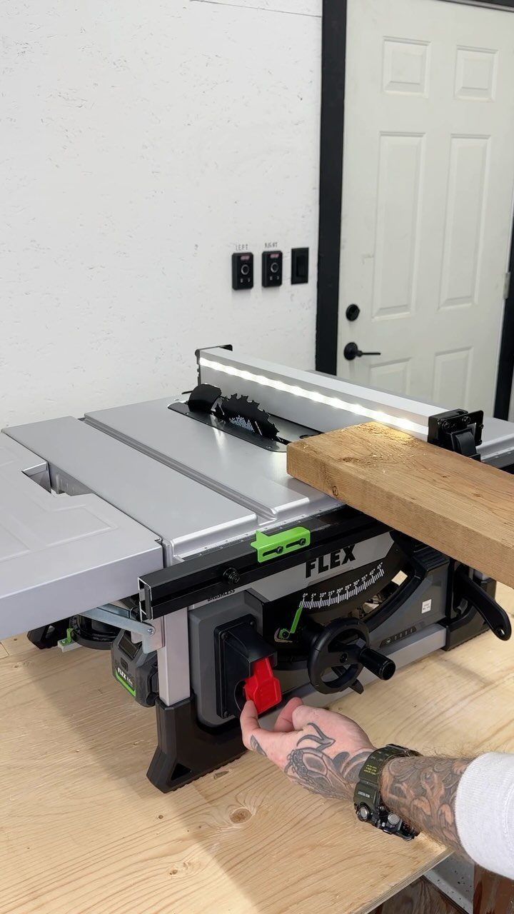 13 Carpentry Tools and Equipment for Every Workshop 5 FLEX table saw with a piece of wood resting on the metal surface.