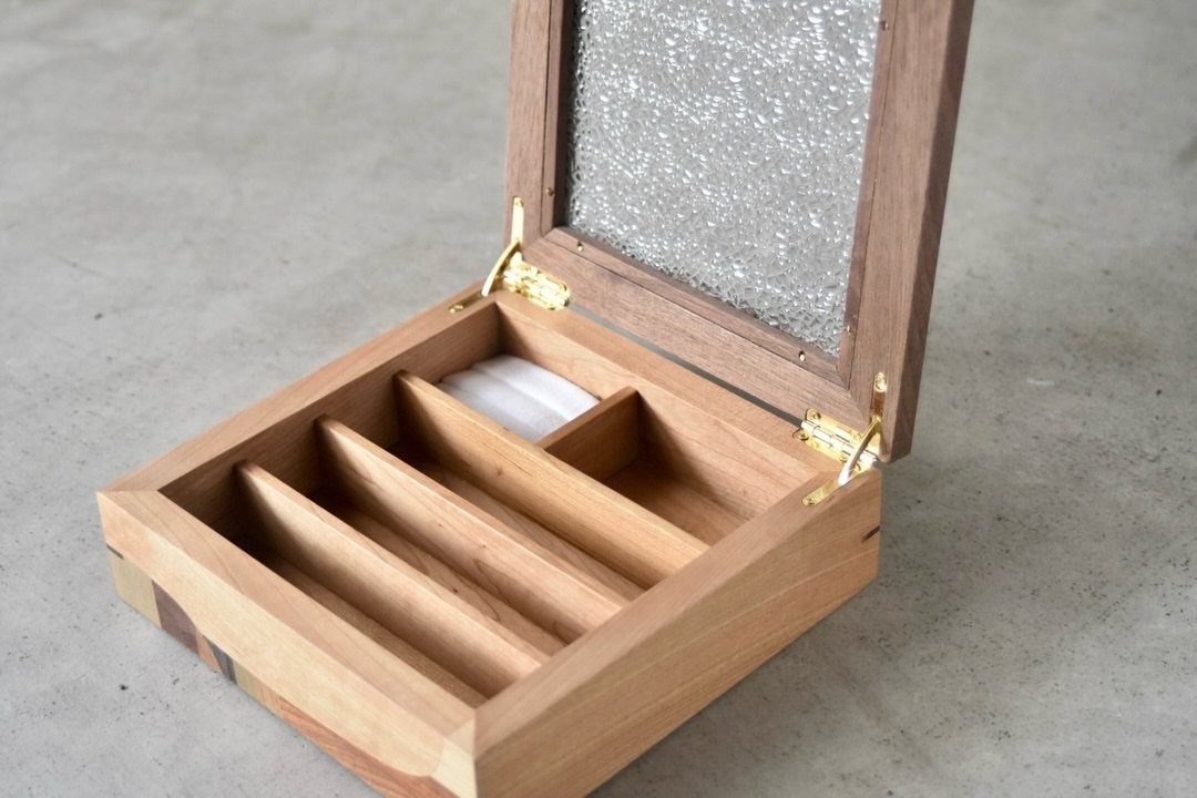 Cherry Wood Projects: 9 Ideas for Bowls, Boxes and More 8 Wooden storage box with glass lid and dividers on a grey concrete floor
