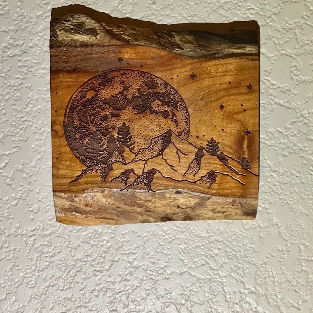 Cherry Wood Projects: 9 Ideas for Bowls, Boxes and More 3 Wood burning art of wolves and mountains under a moon on cherry wood.