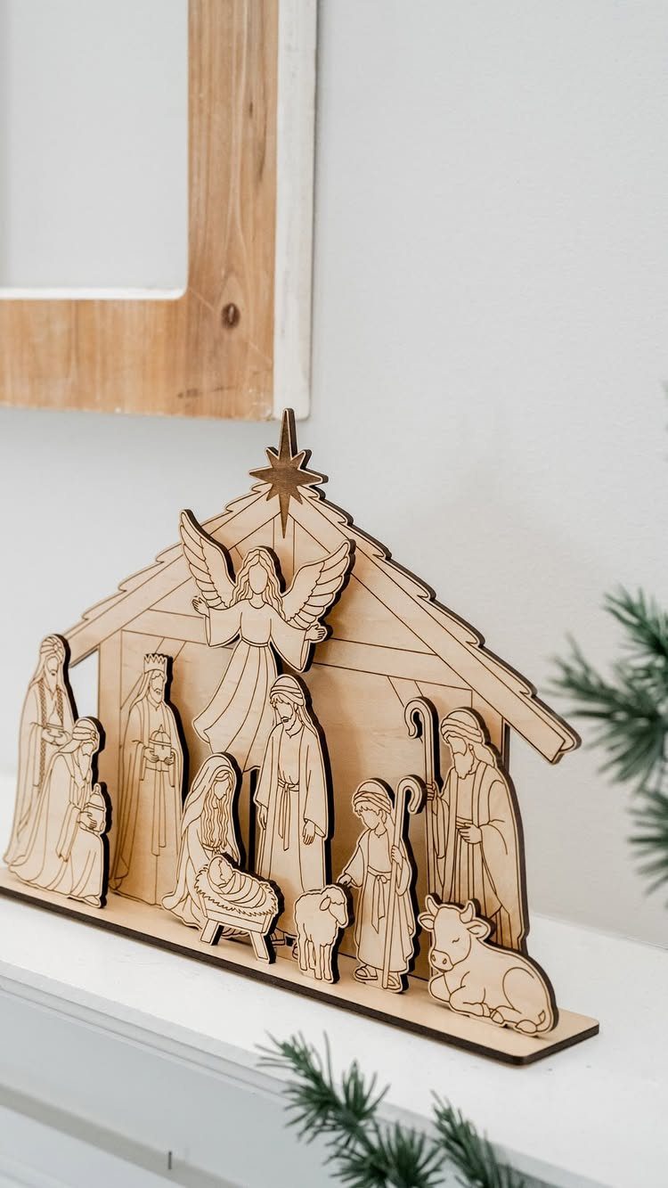 Christian Woodworking Projects: 9 Ideas for Home and Gifts 6 Wooden laser-cut nativity scene with figures in a stable on a white mantel