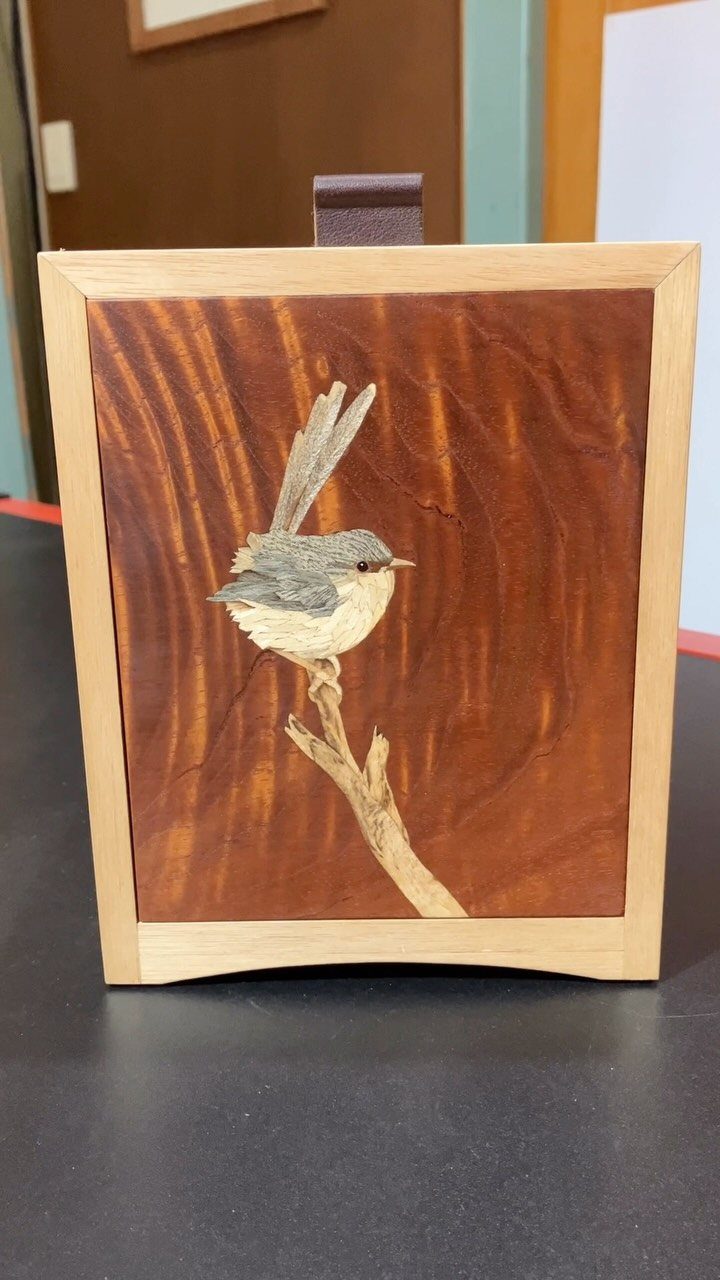 Creative Wood Designs: 8 Ideas for Furniture and Decor 5 Wooden intarsia carving of a small bird perched on a branch in a frame