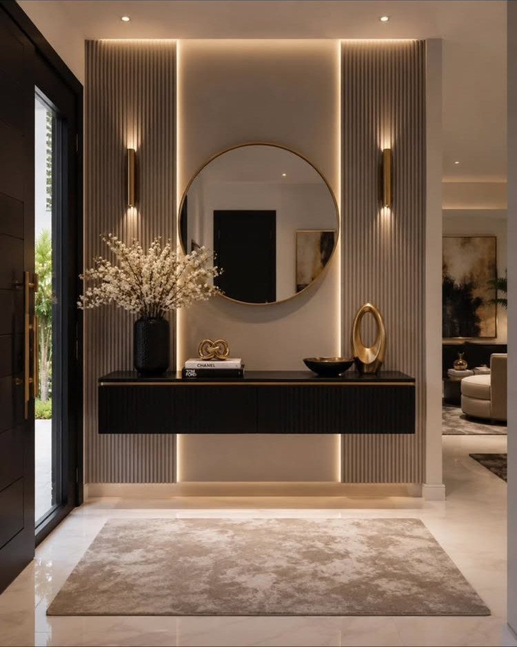 DIY Entryway Table Ideas and Plans: 4 Simple Builds 4 Floating black console table in a modern entryway with a round gold mirror.