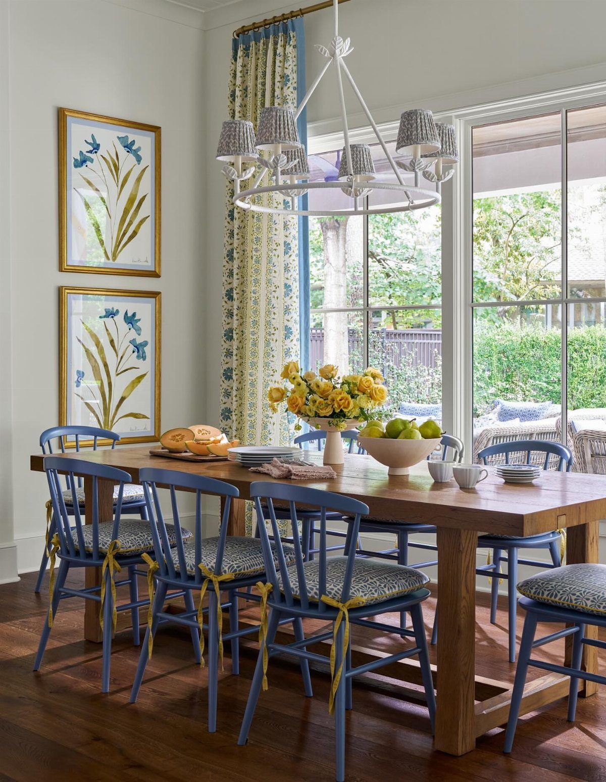 DIY Kitchen Chairs: 6 Ideas for Wood and Upholstery 1 Blue dining chairs with patterned upholstered seats around a rustic wooden table.