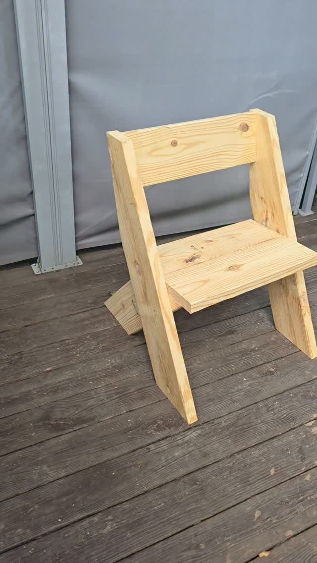 10 DIY Outdoor Chair Ideas for Patios, Porches and Decks 10 Unfinished light wood DIY chair on a grey wooden deck background.