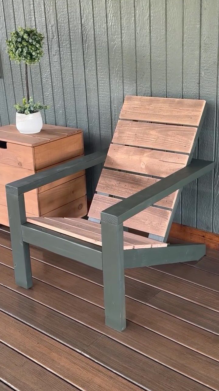 10 DIY Outdoor Chair Ideas for Patios, Porches and Decks 8 Wooden outdoor chair with grey-green frame and natural wood slats on a deck.