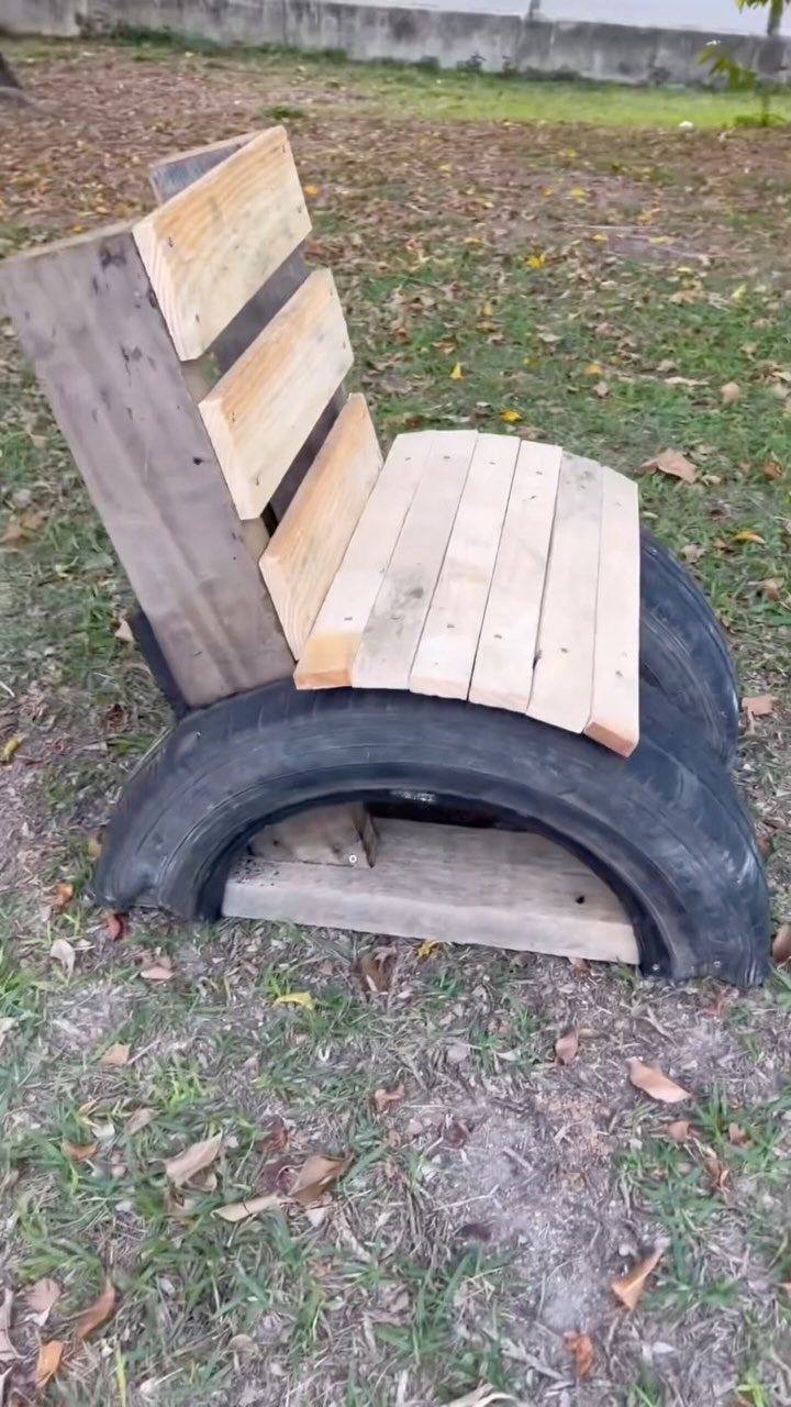 10 DIY Outdoor Chair Ideas for Patios, Porches and Decks 4 Handmade outdoor chair made from wooden slats and a black rubber tire base.