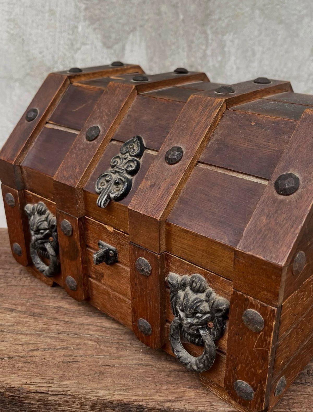 How to Build a DIY Treasure Chest With Wood: 12 Ideas 4 Wooden treasure chest with curved lid, metal studs, and ornate gargoyle ring handles.
