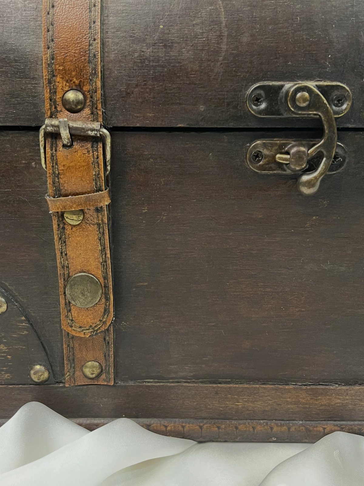 How to Build a DIY Treasure Chest With Wood: 12 Ideas 6 Dark brown wooden treasure chest with leather strap and brass latch hardware