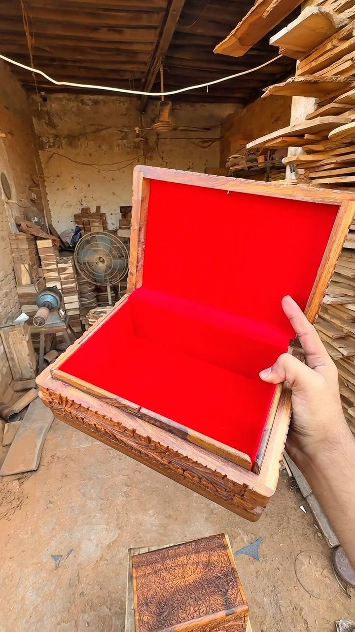 How to Build a DIY Treasure Chest With Wood: 12 Ideas 7 Carved wooden treasure chest with red velvet lining held open in a workshop