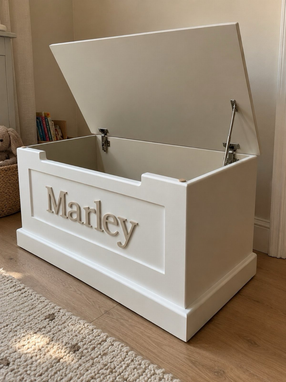 White wooden toy box with open lid and name Marley on the front.