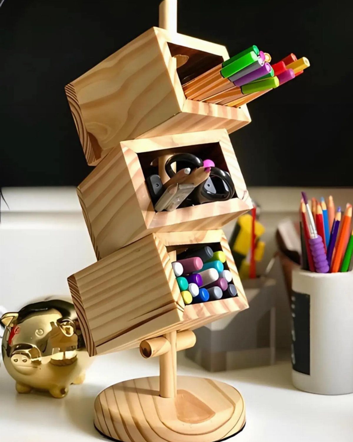 16 DIY Wooden Projects for Home, Garden, and Holiday Decor 6 Wooden desk organizer with three tilted compartments holding colorful pencils and markers.