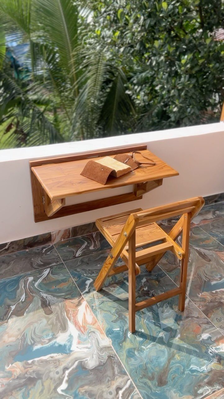 Furniture Design with Wooden Details: 9 Ideas for Home 2 Wooden floating desk and folding chair on a marbled floor with green plants.
