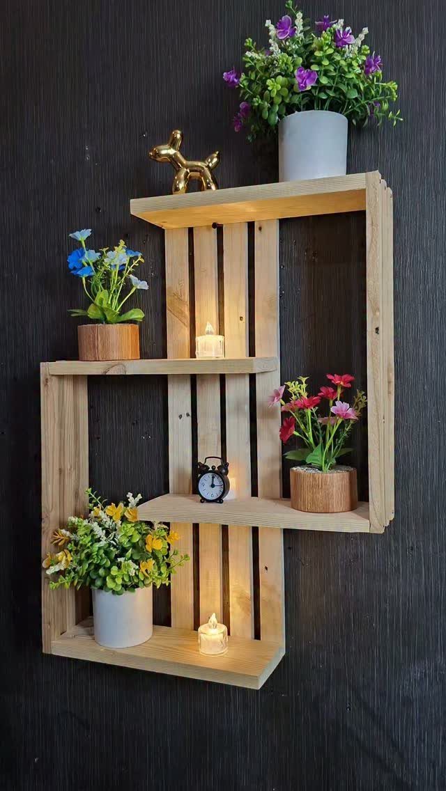 Furniture Design with Wooden Details: 9 Ideas for Home 9 Wooden wall shelf with staggered compartments holding potted flowers, candles, and a clock.
