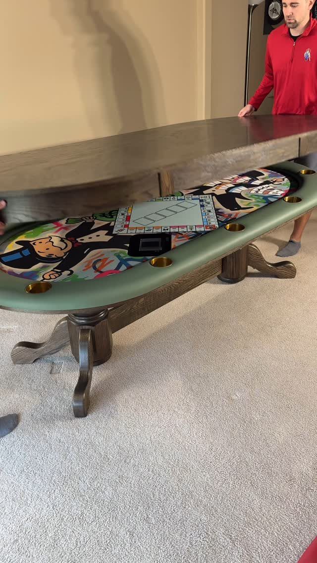 Custom wooden game table featuring a Monopoly board and colorful comic art surface.
