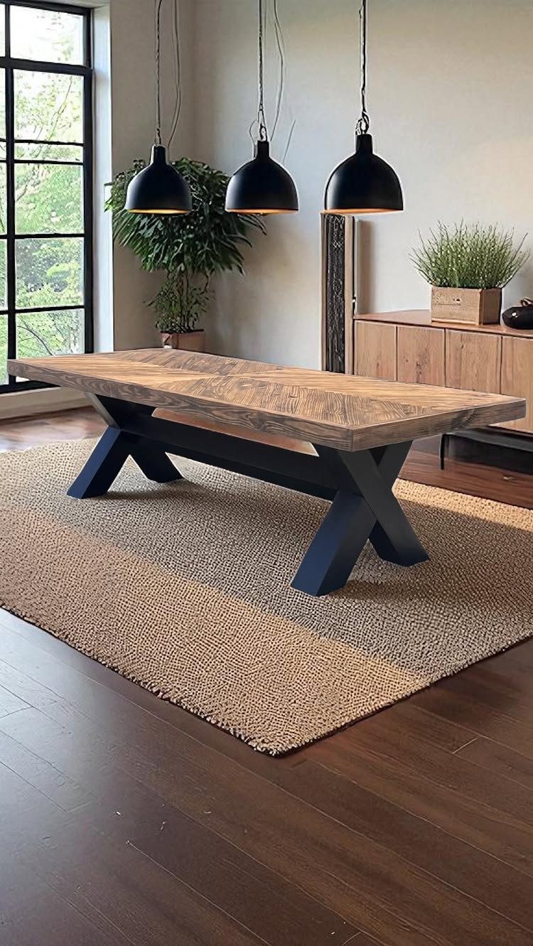 Furniture Plans Free for 16 Tables, Beds and Benches 4 Rustic wooden dining table with black X-shaped legs on a tan woven rug.