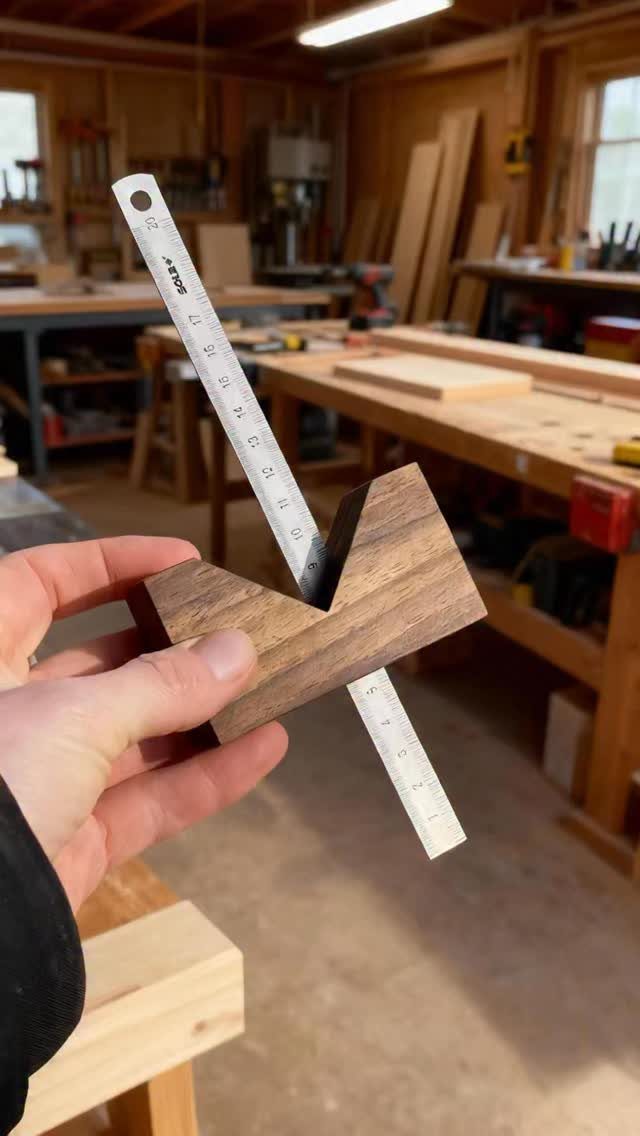 7 Homemade Tools for Woodworking You Can Build 7 Homemade wooden square tool with a metal ruler held in a woodworking shop.