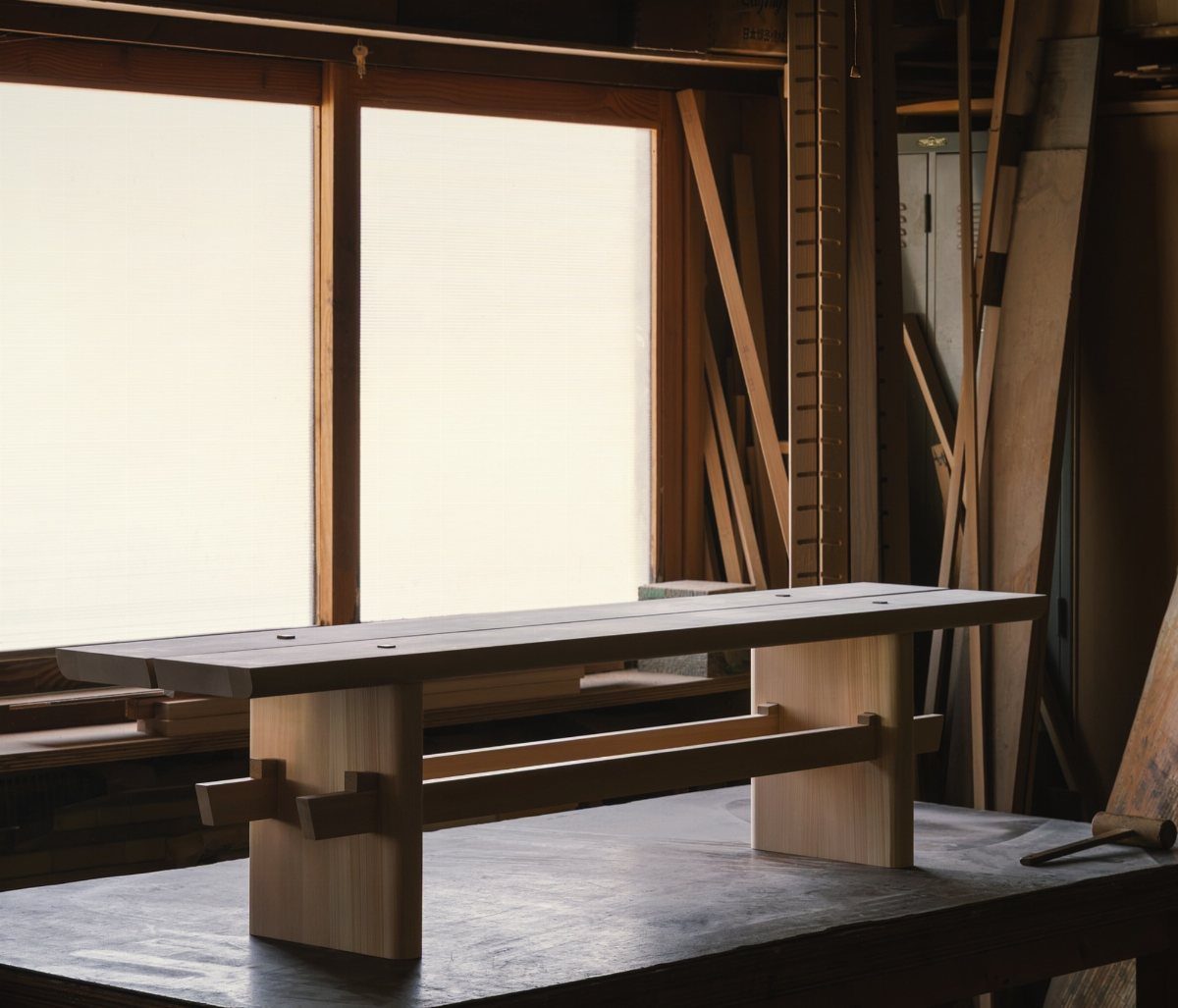 Japanese joinery coffee table made of light wood in a woodworking studio