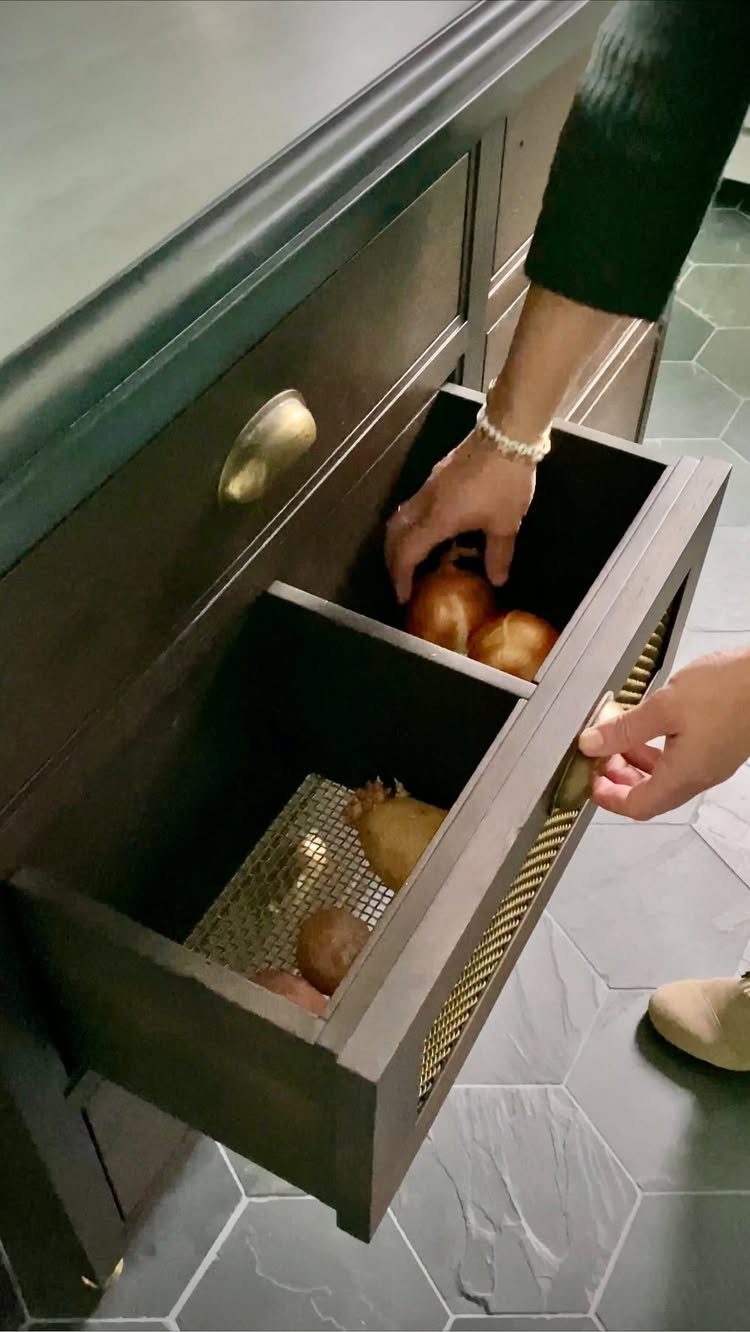 18 Kitchen Woodworking Projects for Storage and Gifts 9 Divided wooden kitchen drawer with mesh front containing onions and potatoes