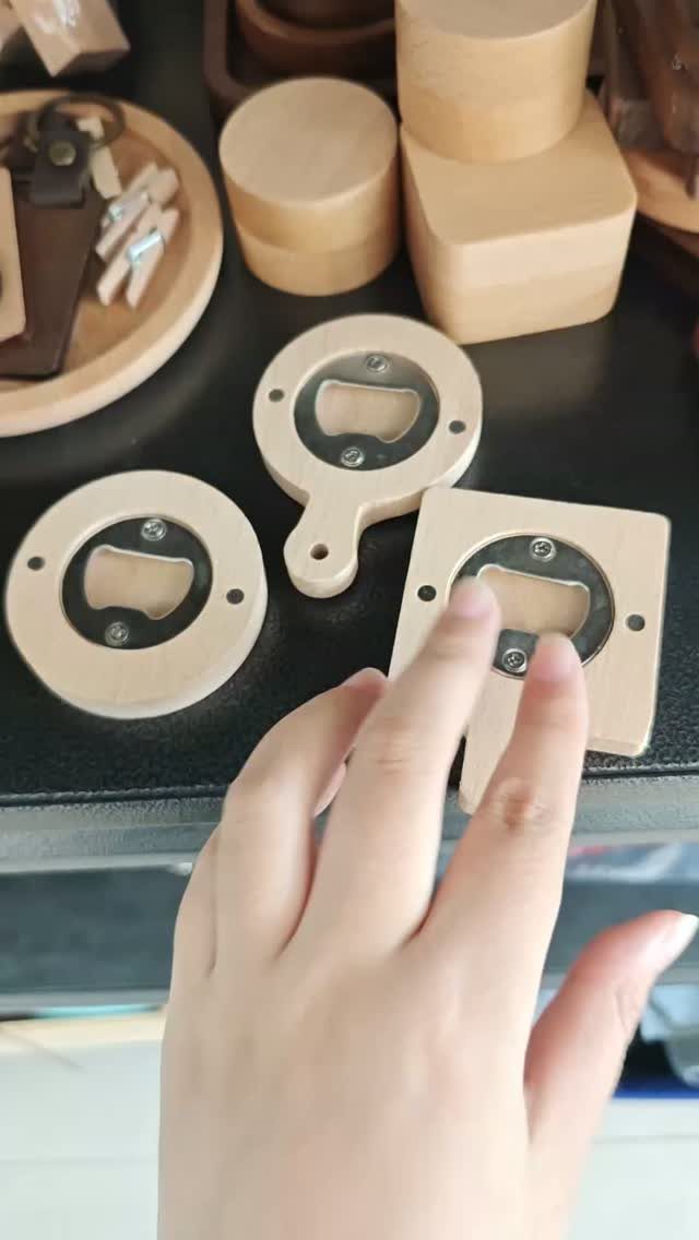 18 Kitchen Woodworking Projects for Storage and Gifts 17 Wooden bottle openers and small wooden blocks on a black tabletop.