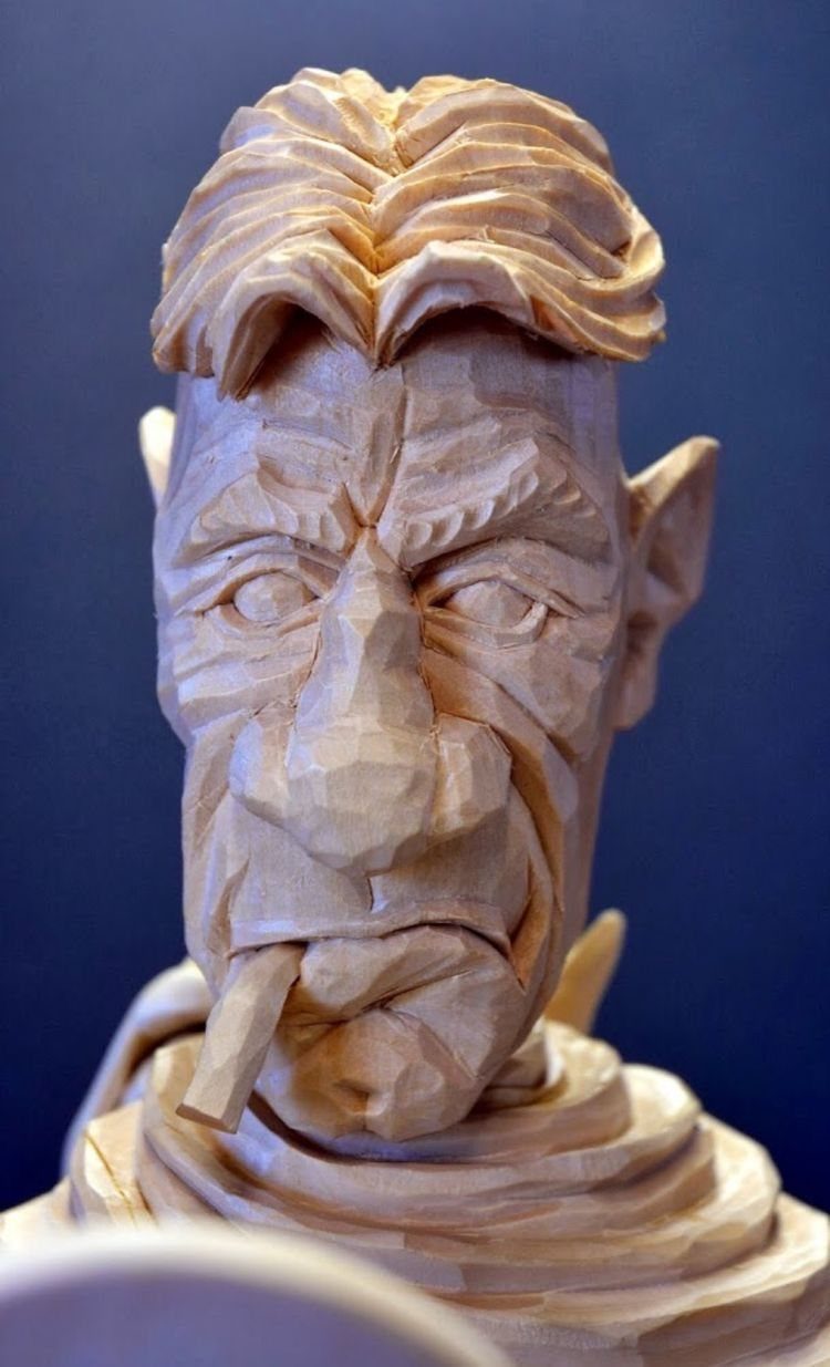 Lynn Doughty Carving: 4 Ideas for Busts and Projects 4 Wooden carving of a grumpy man's face with a cigar in his mouth