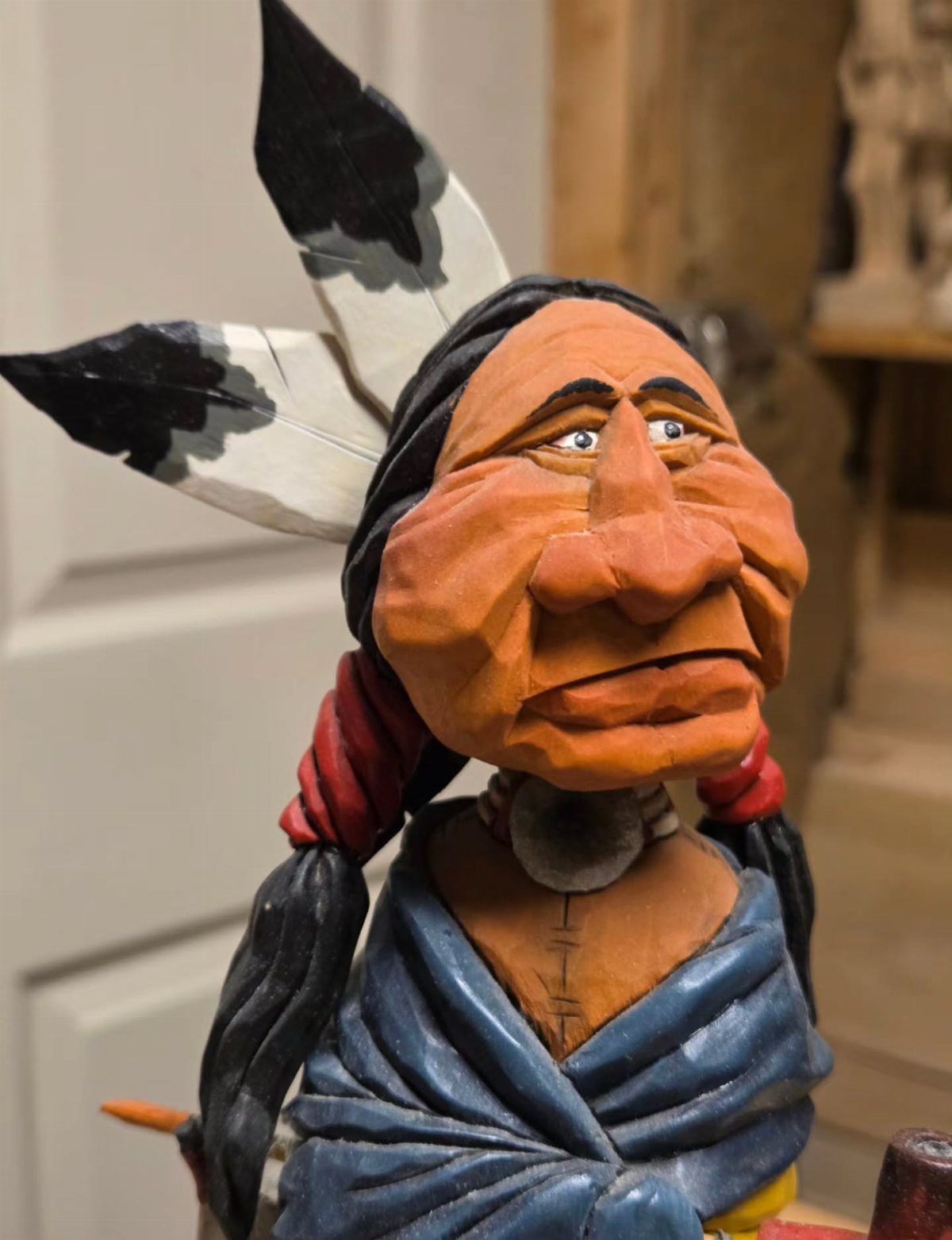 Lynn Doughty Carving: 4 Ideas for Busts and Projects 2 Hand-carved wooden sculpture of a Native American man with a feathered headdress.