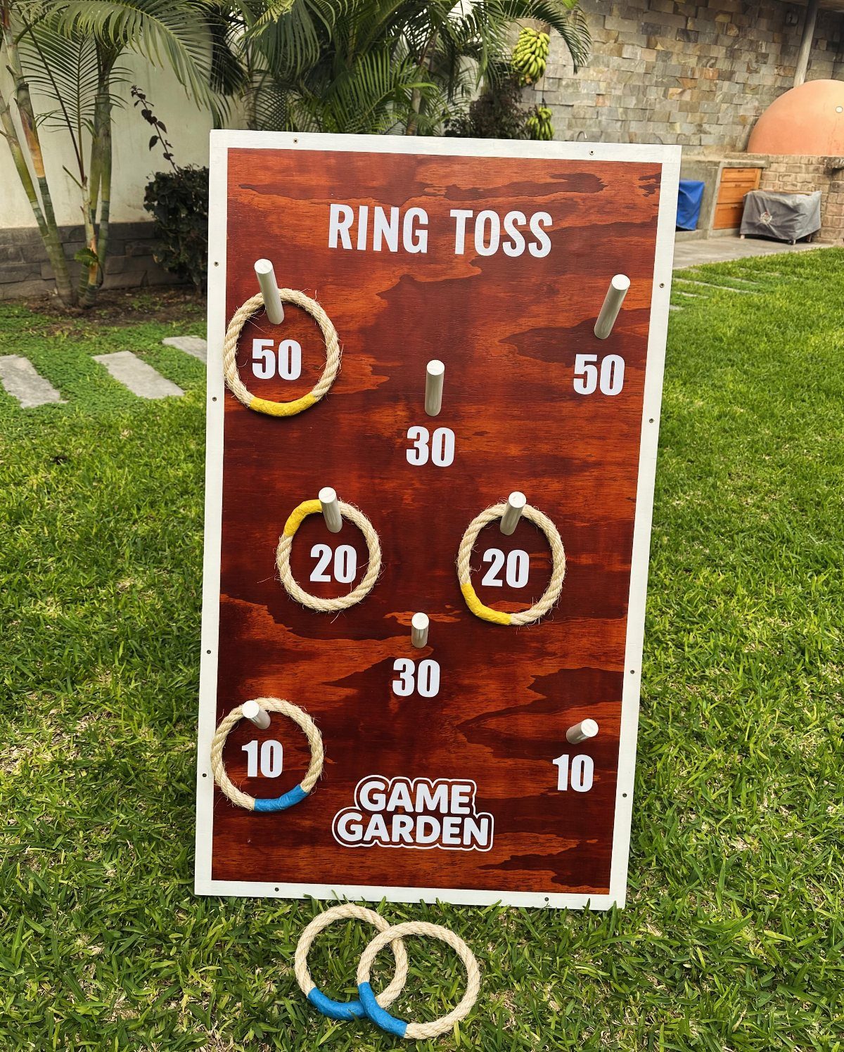 32 Mini Wood Projects for Beginners and Scrap Wood 26 Wooden ring toss game board with rope rings on a green lawn