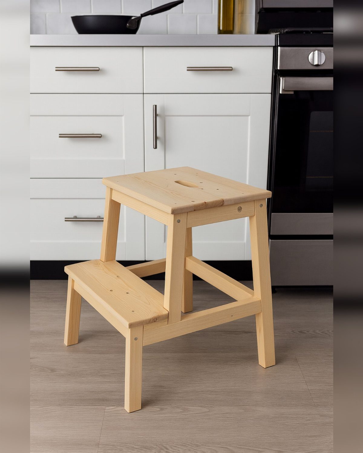 32 Mini Wood Projects for Beginners and Scrap Wood 23 Wooden two-step stool standing on a kitchen floor in front of white cabinets.