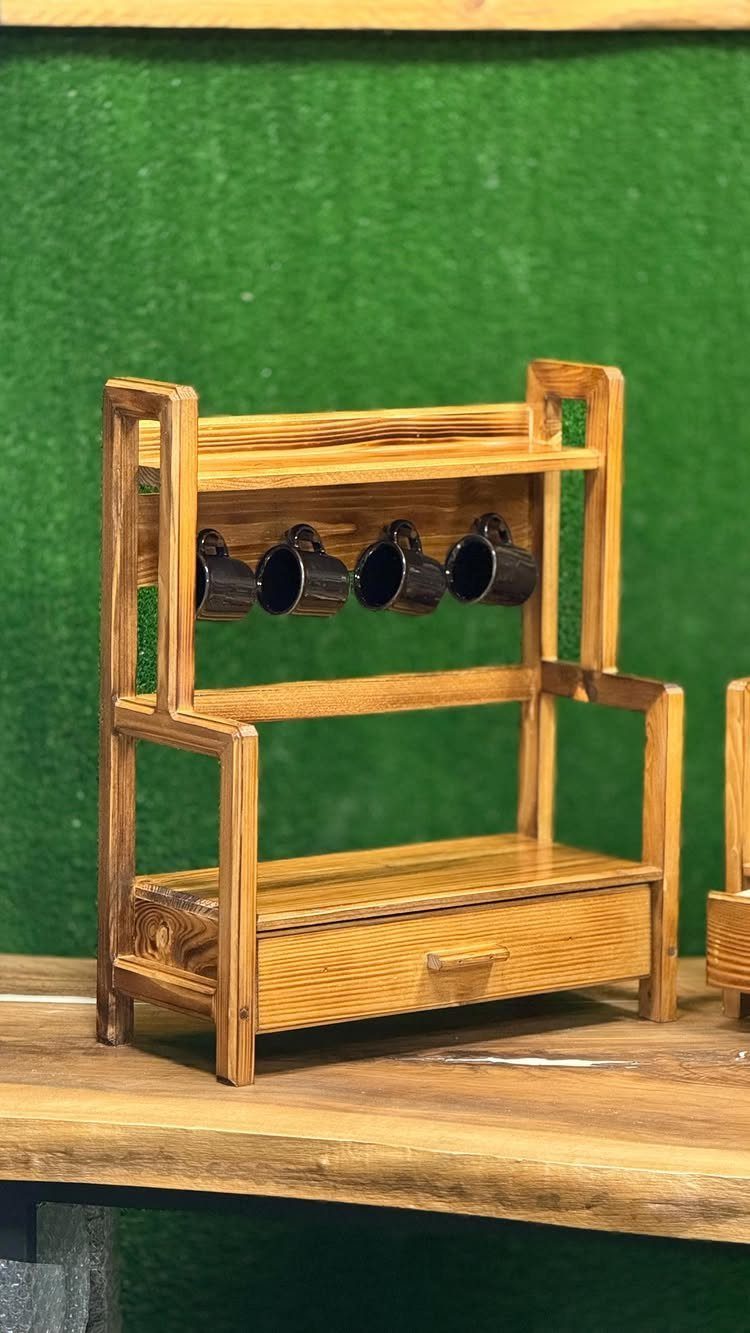 32 Mini Wood Projects for Beginners and Scrap Wood 32 Miniature wooden shelf unit with tiny black mugs and a small drawer.