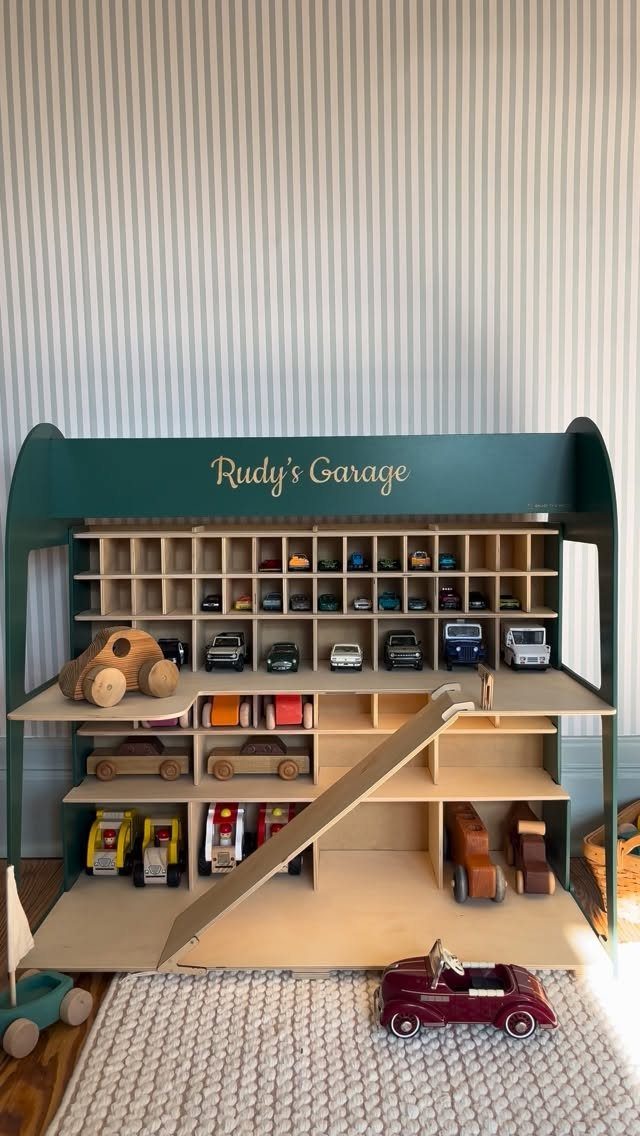 14 Reclaimed Wood Projects for Rustic Home Decor 2 Wooden toy garage with shelves and ramp holding various colorful toy cars