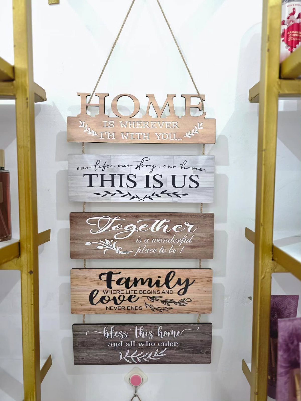 13 Scrap Wood Art Ideas for Using Up Your Leftover Boards 12 Wooden hanging wall art with multiple planks featuring quotes about home and family.