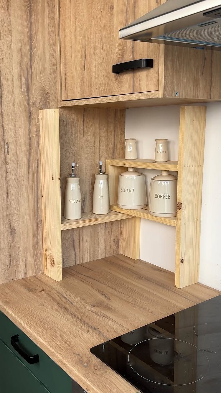 Wooden corner shelves in a kitchen holding ceramic coffee and sugar canisters.