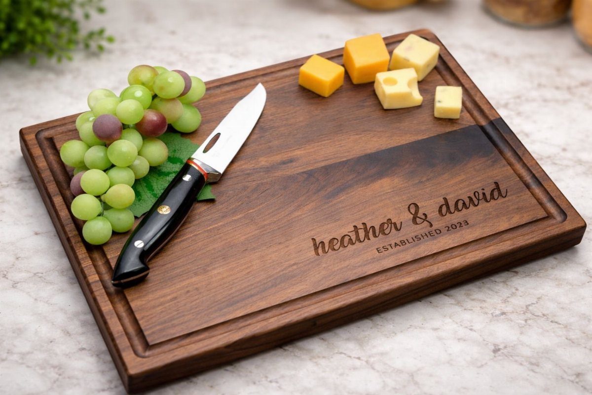 13 Small Wood Craft Ideas for Beginners and Scrap Wood 1 Personalized wooden cutting board with grapes, cheese, and a knife on marble.