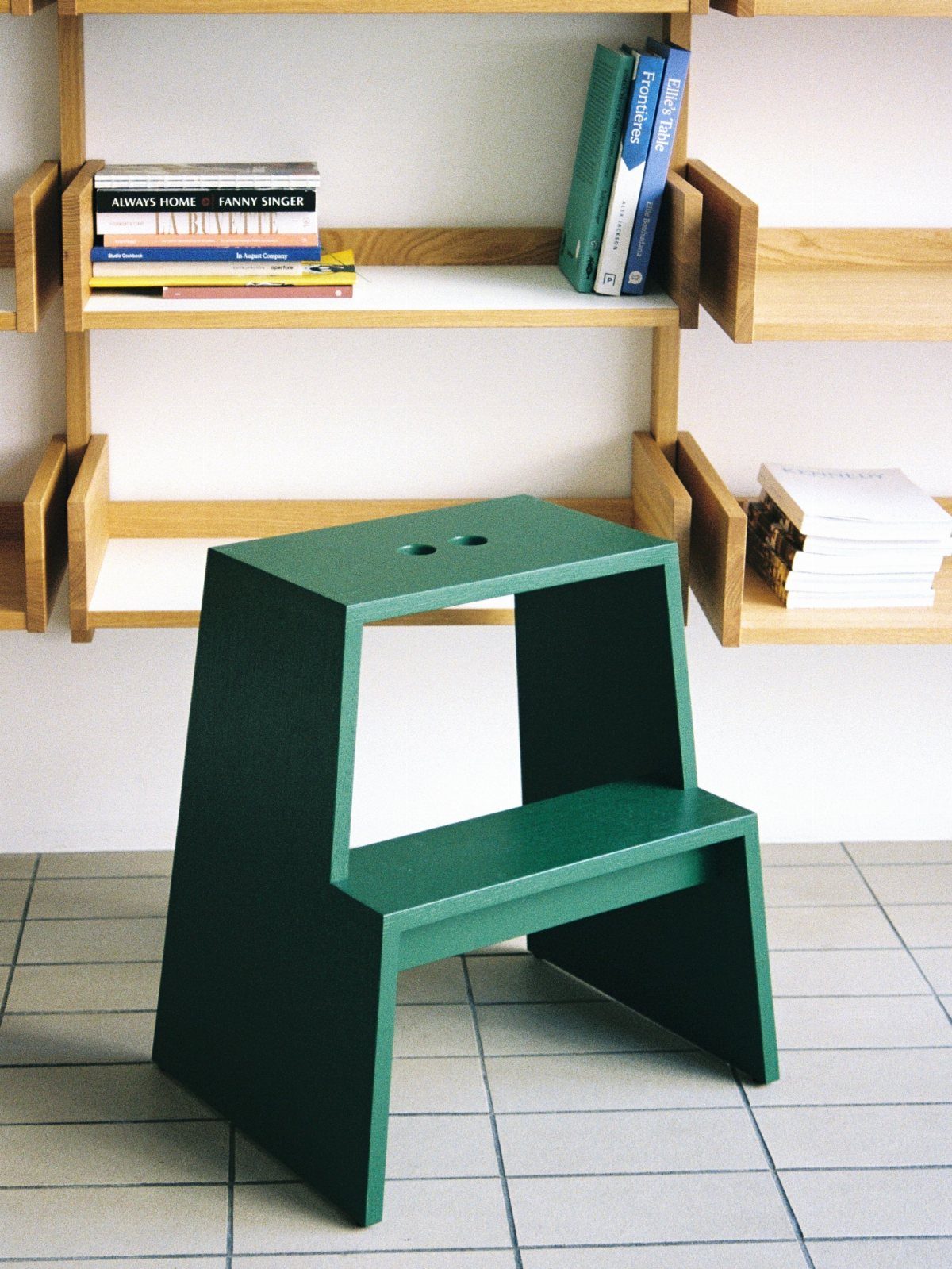 13 Small Wood Craft Ideas for Beginners and Scrap Wood 13 Green wooden step stool with two levels sitting on a tiled floor.