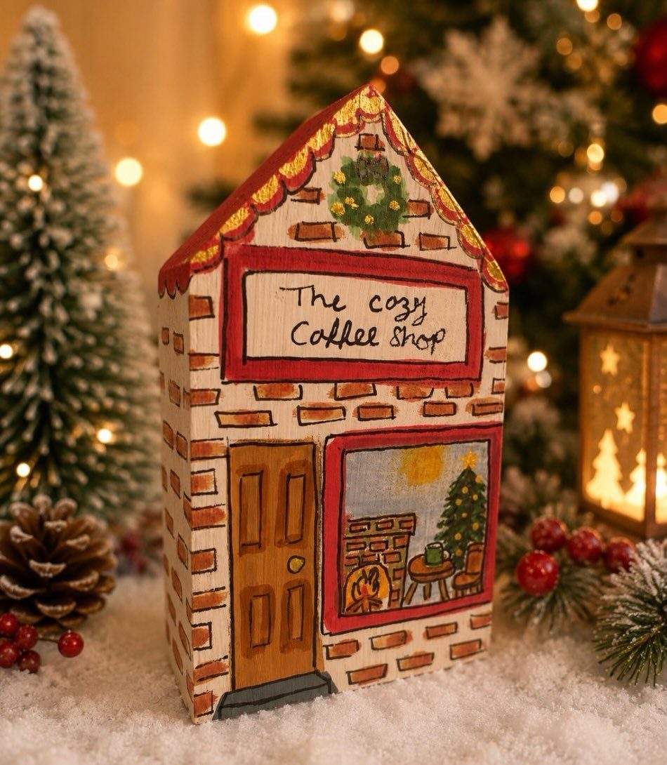 21 Small Wood Projects for Christmas You Can Make 20 Hand-painted wooden coffee shop miniature house in a snowy Christmas village setting.