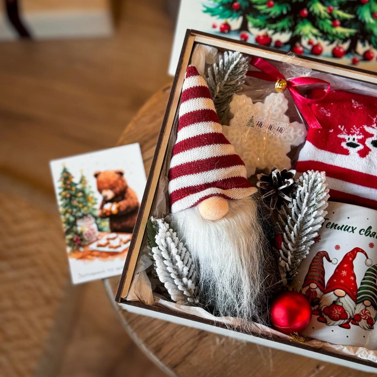 21 Small Wood Projects for Christmas You Can Make 21 Wooden gift box filled with a gnome, red stocking, and Christmas decorations.