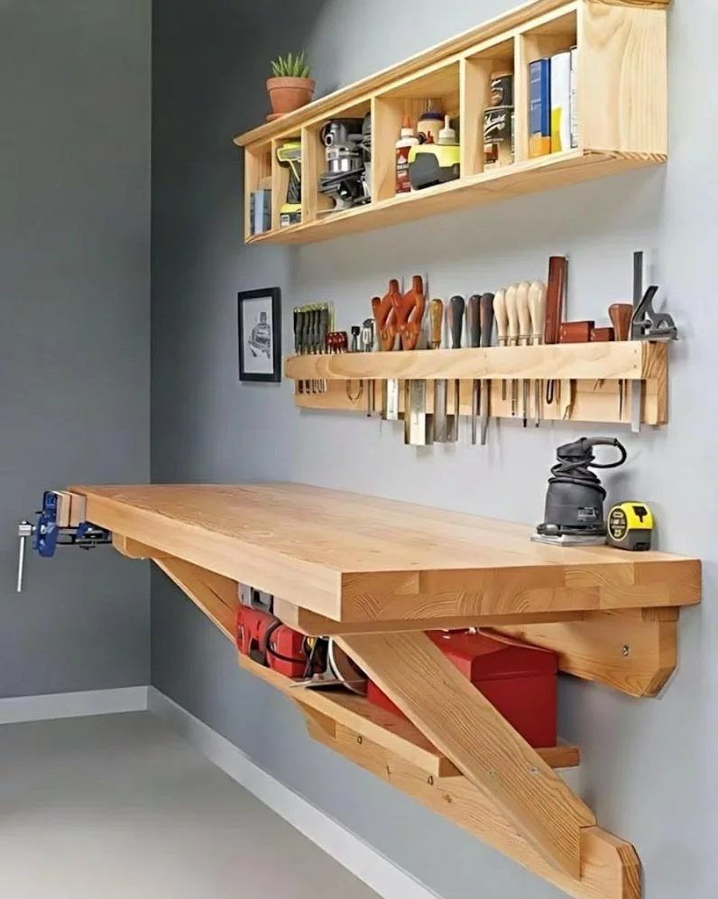 Space Saving Workbench Ideas: 4 Designs for Small Shops 1 Wooden wall-mounted compact workbench with tool storage and a red toolbox underneath.