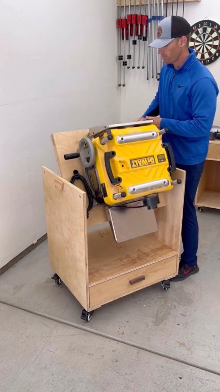 Space Saving Workbench Ideas: 4 Designs for Small Shops 2 Man standing by a yellow power tool mounted in a mobile plywood workbench cart.