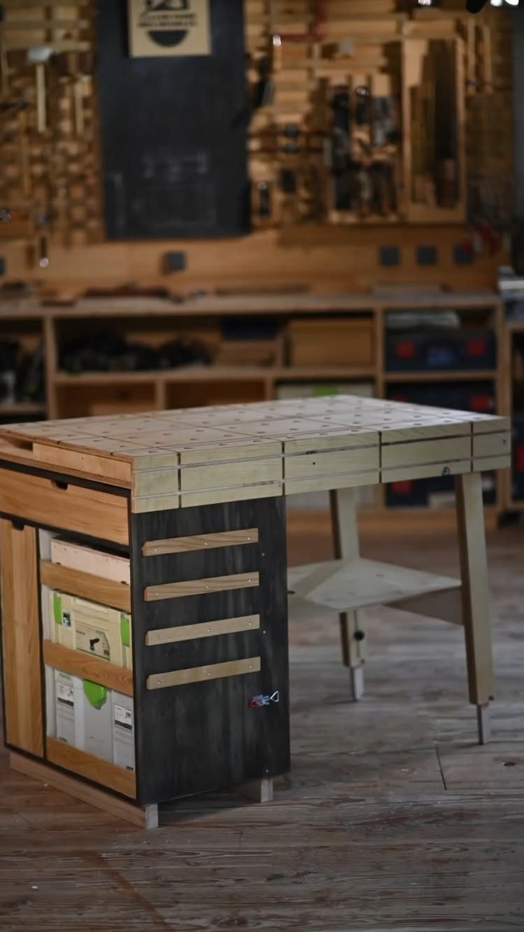 Space Saving Workbench Ideas: 4 Designs for Small Shops 3 Wooden workbench with built-in storage drawers in a professional woodworking workshop setting