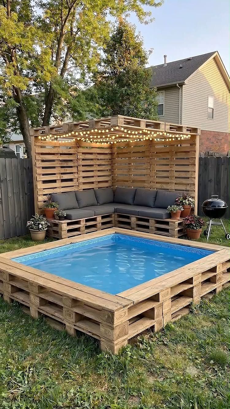 24 Summer Wood Projects for Beginners and Weekend Builders 20 Small blue swimming pool surrounded by a light wood pallet frame in a backyard