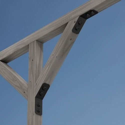 Timber Frame Joinery: 4 Joints and Details to Know 2 Timber knee brace connecting a vertical post and horizontal beam with black metal brackets.