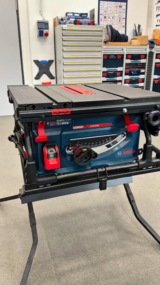 Bosch table saw on a stand in a professional woodworking workshop setting