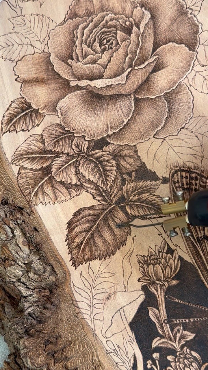 Wood Burning Art: 8 Ideas for Spoons, Coasters and More 8 Wood-burning tool detailing a large rose and leaves on a natural wood slab.