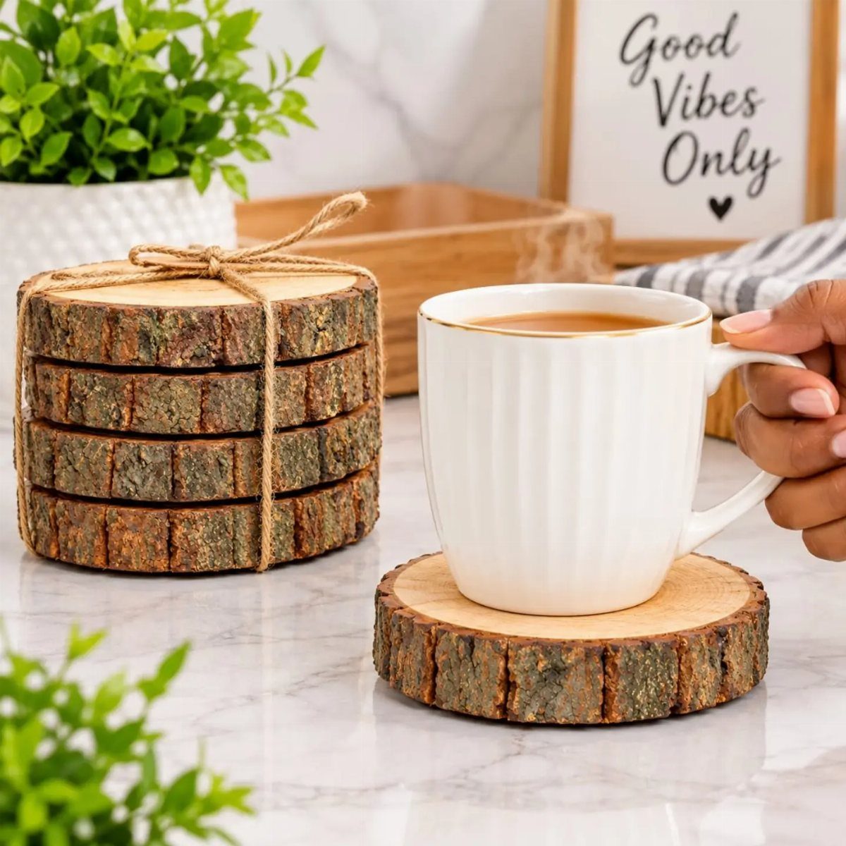 Rustic wood slice coasters tied with twine next to a white coffee mug.