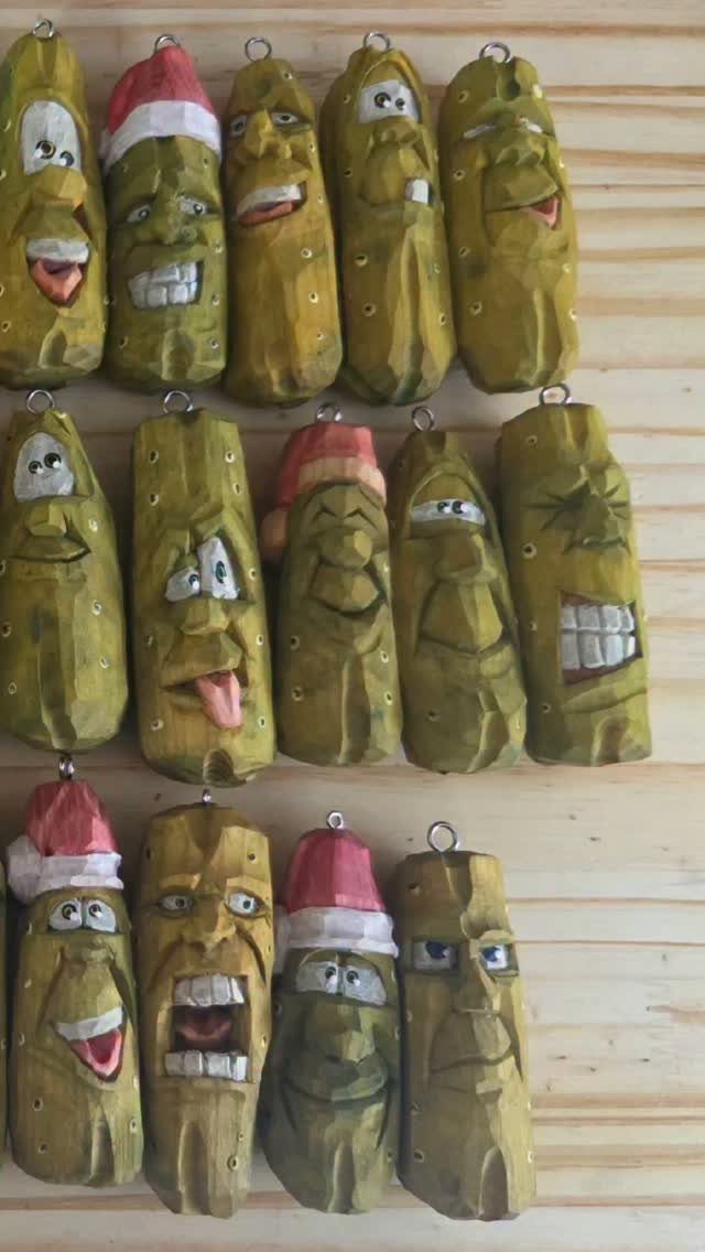 Wood Carved Ornaments: 7 Ideas for Holiday and Home 1 Carved wooden pickle ornaments with funny faces and Santa hats on a wooden wall