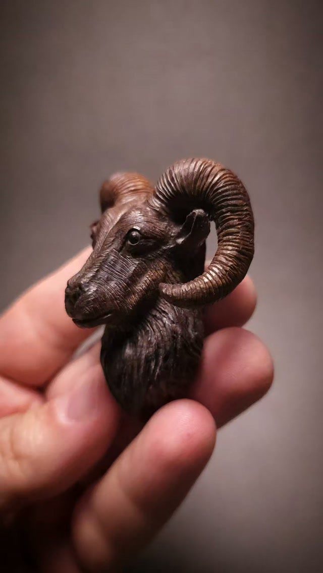 Wood Carving Animals: 14 Ideas to Try With a Knife 13 Small wood carving of a ram's head held in a person's hand.