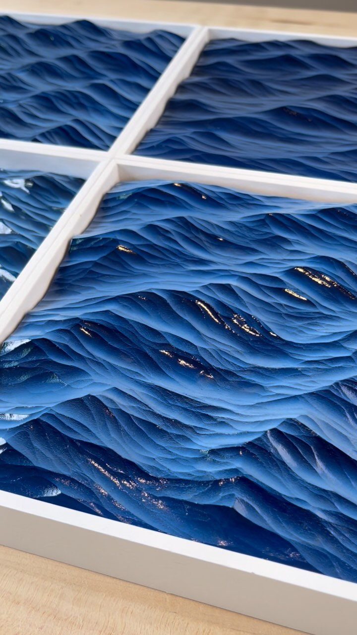 5 Wood Carving Tutorials for Spoons, Waves and Fairy Houses 3 Carved blue waves in a white frame, mimicking the appearance of flowing ocean water.