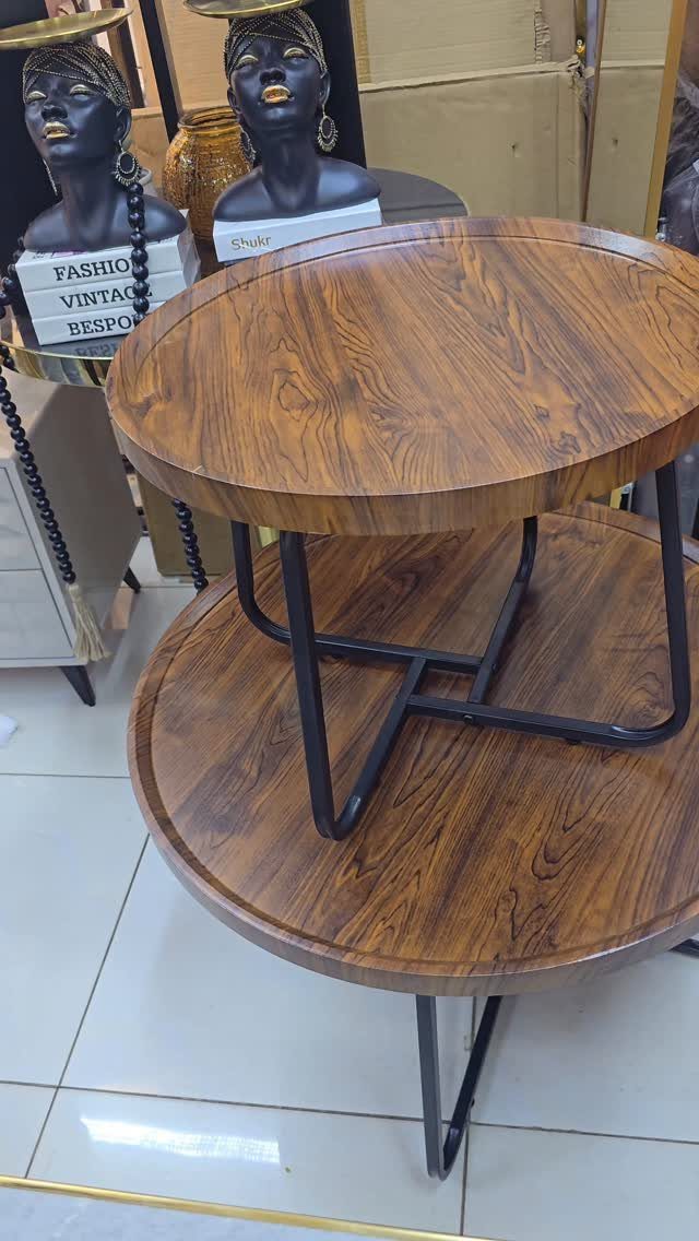 14 Wood Ideas to Sell: Easy Projects for Craft Fairs 7 Two-tiered round coffee table with dark wood grain and black metal legs.