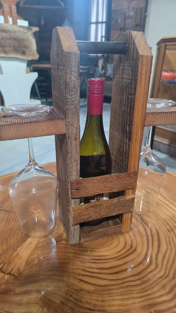 14 Wood Ideas to Sell: Easy Projects for Craft Fairs 8 Rustic wooden wine rack holding a bottle and two glasses on a wood table.
