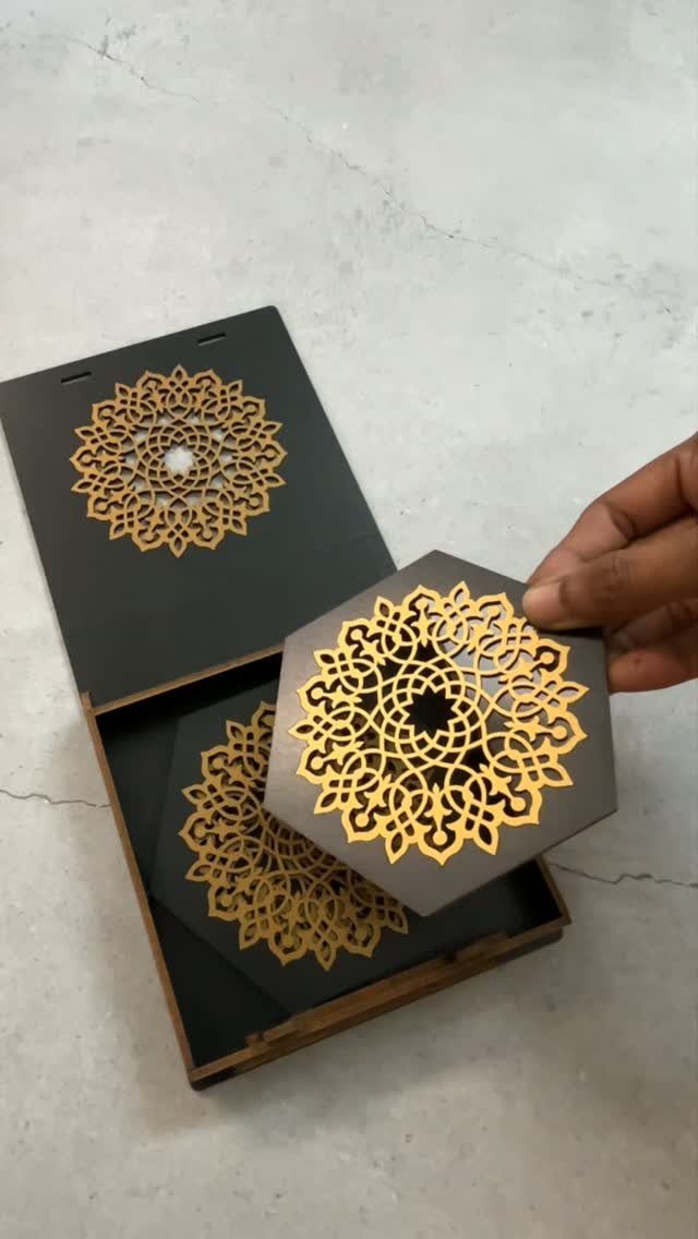 14 Wood Ideas to Sell: Easy Projects for Craft Fairs 9 Hexagonal wooden coasters with intricate gold mandala patterns in a black box.
