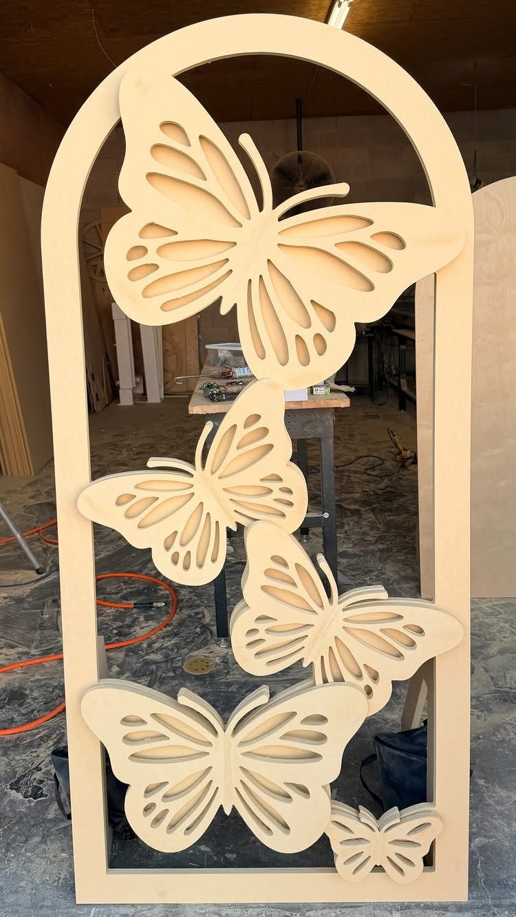 Wood Piece Art Ideas: 25 Designs for Walls and Shelves 18 Carved wooden butterflies of different sizes inside a tall arched wooden frame.